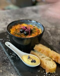 Gratinert klippfisk (saltet og tørket torsk) servert på Restaurant Varde, Havila Hotel Ivar Aasen i Ørsta.